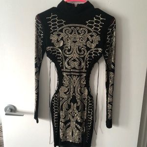 Black with gold embellishment, cut out dress